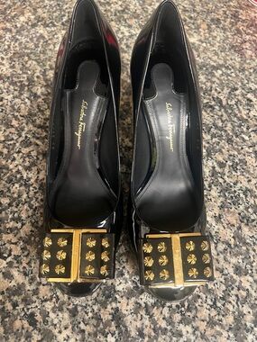 Salvatore Ferragamo Black Patent Pumps with Gold Studded Bow